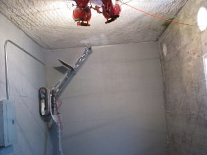 Remote climbing platform from ICM applying fixative inside hot cell testbed