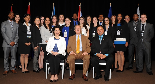 DOE Fellows gather with EM Lead Foreign Affairs Specialist Ana Han, front row, left to right, EM Acting Assistant Secretary David Huizenga, and Florida International University Applied Research Director Dr. Leonel E. Lagos at the Waste Management 2014 Conference.
