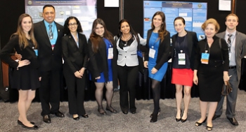 Pictured here are DOE Fellows with Florida International University Applied Research Center staff, including Dr. Leonel E. Lagos, second from left, and Dr. Yelena Katsenovich, second from right, at the Waste Management 2014 Conference Student Poster Competition.