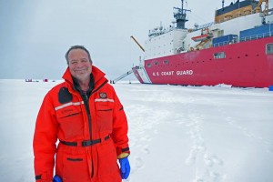 Dr. Kadko at the North Pole with the US Healy on the background